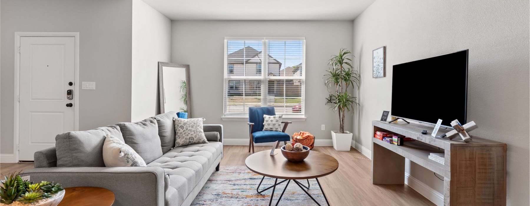 a living room with a couch and a table