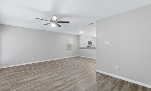 a living room with wood floors